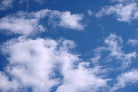 Background from clouds. Beautiful celestial landscape with beautiful white clouds high in the skyの写真素材