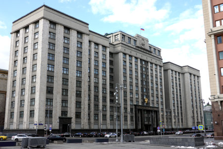 The State Duma of Russian Federation building with many official cars before it facadeの写真素材