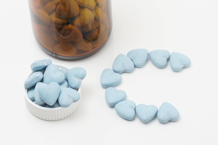 Vitamin bottle with blue vitaminsの写真素材