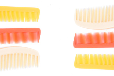 Plastic hairbrush on white background with selective focusの写真素材