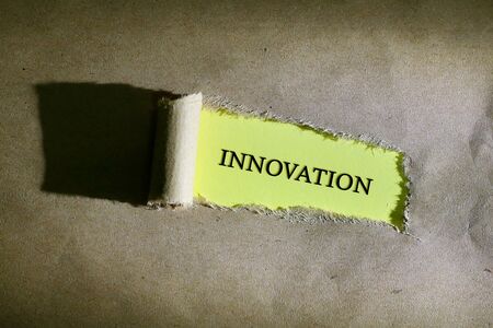 Torn paper with word Innovationの写真素材