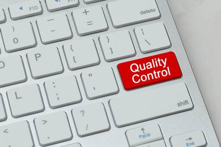 Quality Control word on red button keyboardの写真素材