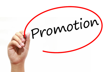 Man Hand writing Promotion with marker on transparent wipe board. Business, internet, technology concept.の写真素材