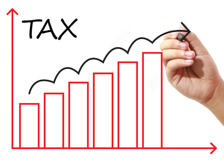 Businessman drawing TAX Graph on virtual screen. Business, banking, finance and investment concept.の写真素材