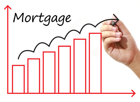 Businessman drawing Mortgage Graph on virtual screen. Business, banking, finance and investment concept.の写真素材