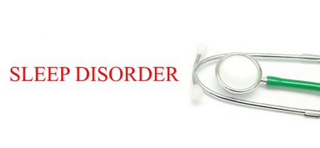 Close up Stethoscope and words Sleep Disorder over white backgroundの写真素材