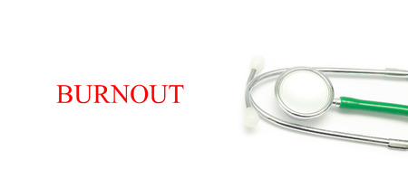 Close up Stethoscope and words Burnout over white backgroundの写真素材