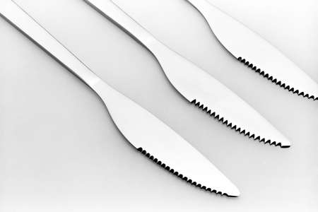 Three knives on a grey backgroundの写真素材