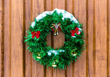 Christmas wreath on a wooden backgroundの写真素材