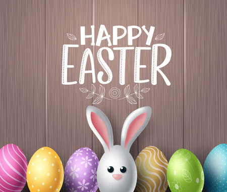 Happy easter vector background design. Happy easter text in wood textured space for text with colorful egg patterns and cute bunny rabbit in wooden background. Vector illustration.のイラスト素材