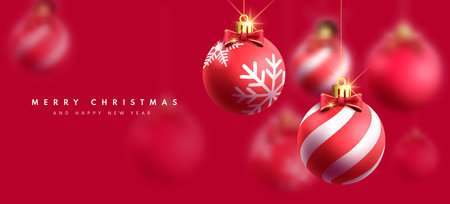 Merry christmas greeting text vector design. Christmas red balls hanging ornaments in elegant red greeting card background. Vector illustration holiday season invitation card.のイラスト素材