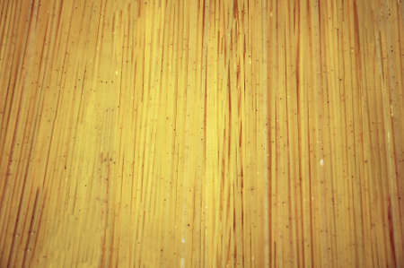 Texture of uncooked spaghetti, design as a background texture for page layoutの写真素材