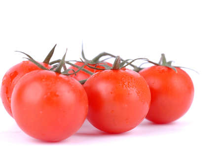 Macro shot of cherry tomatoes isolated on white backgroundの写真素材