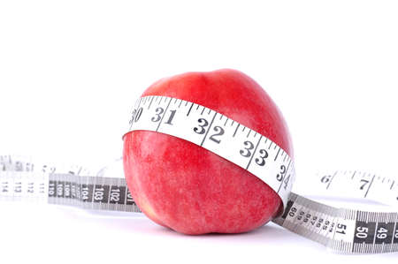 Apple and meter on a white background - Diet compositionの写真素材