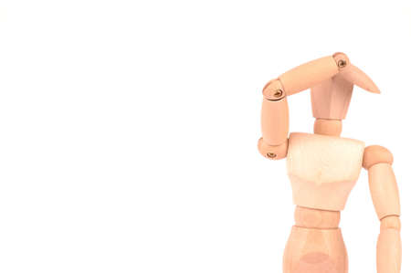 wooden doll has his hand on her head because of headachesの写真素材