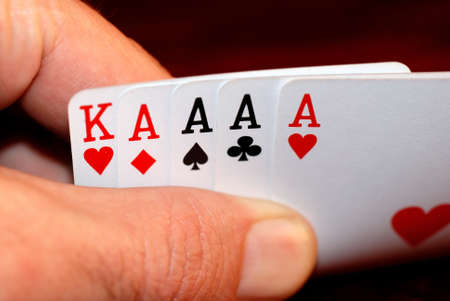 Playing card on hand on the dark backgroundの写真素材