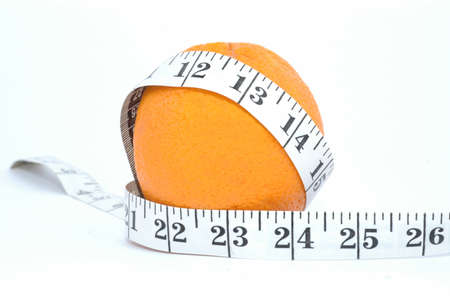 orange and meter on a white background - Diet compositionの写真素材