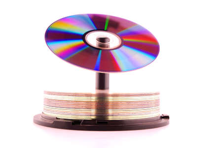 Cd rom with colors of the rainbow on top of stack cd の写真素材