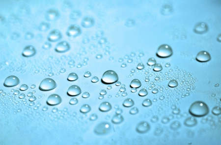 close up Drops on the light blue background, soft focusの写真素材