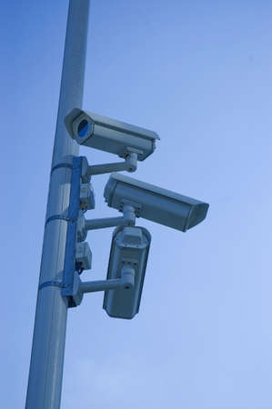 Security camera on the blue sky backgroundの写真素材