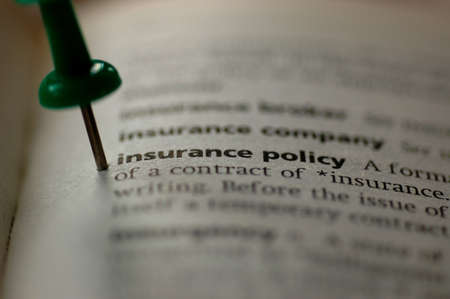 Dictionary definition of insurance policy  Close-up view, with paper texturesの写真素材