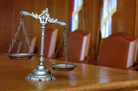 Symbol of law and justice on the table, law and justice concept, focus on the scalesの写真素材