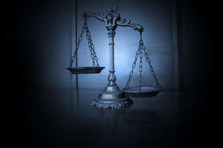 Symbol of law and justice on the table, law and justice conceptの写真素材