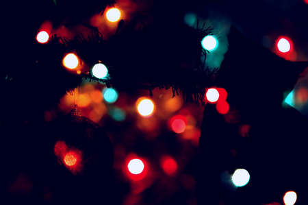 Abstract Christmas and New Year blur colorful background with cat silhouetteの写真素材