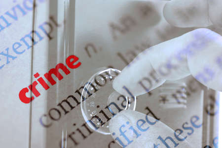 Dictionary definition of crime and hand searching security code of safeの写真素材