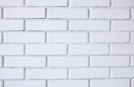 Photo of white brick wall suitable for backgroundの写真素材