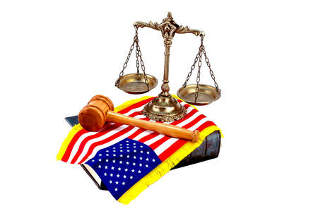 Decorative Scales of Justice on the book with American flag and gavel on white. Law and order conceptの写真素材