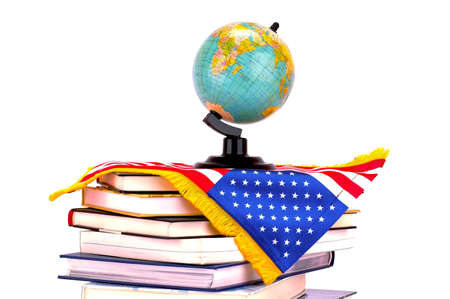 Globe on books with American flag isolated over white backgroundの写真素材