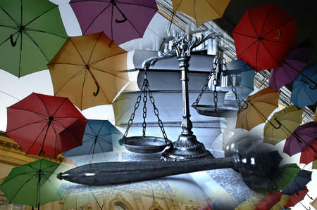 Different colorful umbrellas and decorative scales of justice, concept of legal insuranceの写真素材