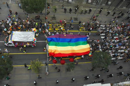 BELGRADE, SERBIA - SEPTEMBER 20, 2015: LGBT oriented people carrying a flag  in Gay Pride Parade in...