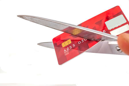 photo of scissors cutting old credit card on white background, SOFT FOCUSの写真素材