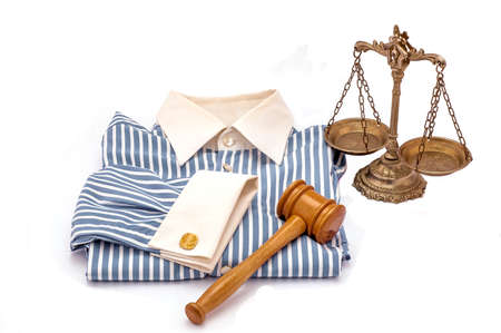 Blue and white cotton shirt, wooden gavel and scales of justice on white backgroundの写真素材