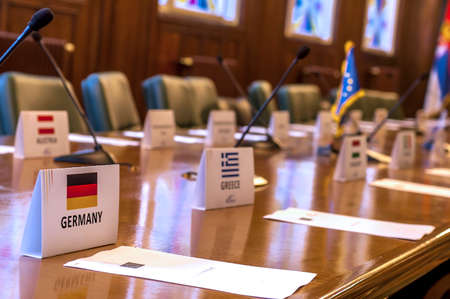 conference place card in the empty conference room, focus on the Germany place card