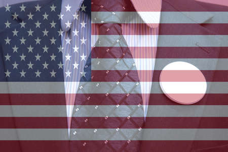 Businessman in suit with blank badges and american flag, concept of American electionの写真素材