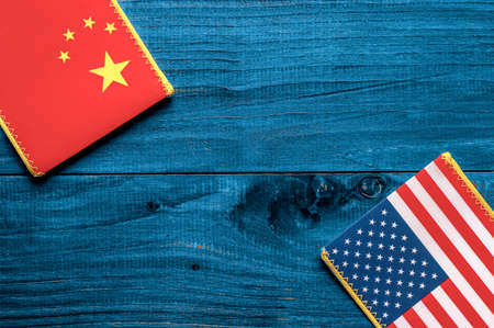American and Chinese flag on wooden backgroundの写真素材