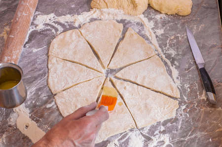 Orange silicone brush for food is lubricated doughの写真素材