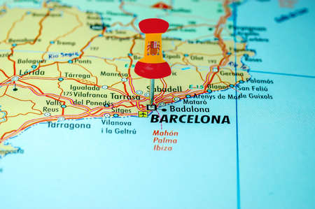Push pin with spain flag stuck on a map centered on the city of Barcelona, Spainの写真素材