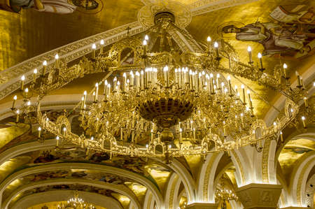 Belgrade, Serbia - February 27, 2020: a golden chandelier with frescoes and arches in the crypt of the Orthodox church Saint Sava in Belgrade, Serbiaのeditorial素材
