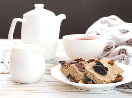 Marble sesame halva with cocoa and cup of tea for breakfast.の写真素材