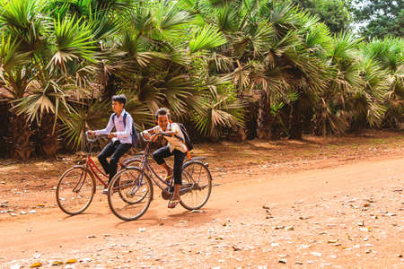 Siem Reap, Cambodia - December 6, 2016: Children returning from school.のeditorial素材