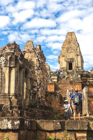 Pre Rup Temple, Siem Reap, Cambodia - December 5, 2016: Towers and galleries and walking tourists at sunny morning.のeditorial素材