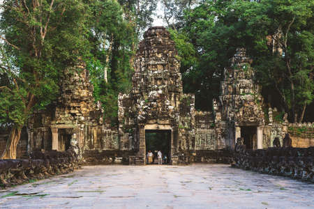 Preah Khan Temple, Siem Reap, Cambodia - December 6, 2016: Towers and galleries and walking tourists at sunny morning.のeditorial素材