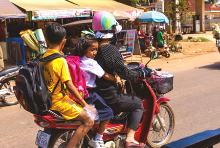 Siem Reap, Cambodia - December 6, 2016: Children returning from school.