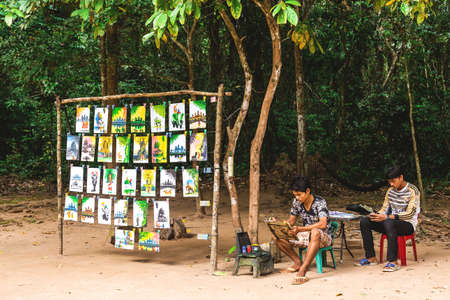 Angkor Wat, Siem Reap, Cambodia - December 5, 2016: dealers and walking tourists at sunny morningのeditorial素材