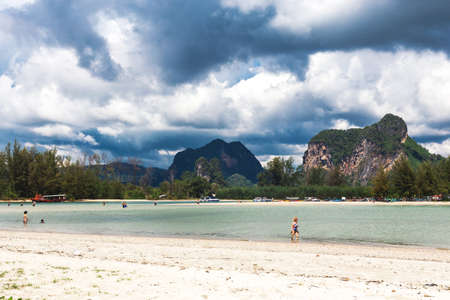 Ao Nang, Krabi Province, Thailand - December 16, 2016: Exotic beach. Sea, tourists and tropical forest.のeditorial素材