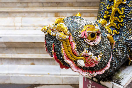 Buddhism dragon guard statue in sunlight, Thailand. Religion conceptの写真素材
